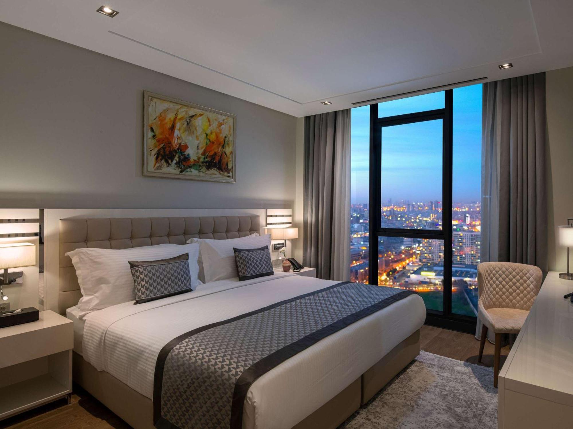Movenpick Living Istanbul Hotell Exteriör bild A bedroom at the hotel